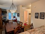 Looking out into the second floor from the kitchen area. Entry to half bathroom is visible